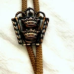 Vintage Western Bolo Tie With Double Crown Slide 1950S Copper Toned Braided Cord. Fixed Price $40.00.