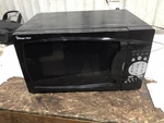 Magic Chef Household Microwave Oven MCM770B1. Fixed Price $50.00.
